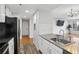 Open concept kitchen with modern stainless appliances and an open view to the living area at 3481 Lakeside Ne Dr # 907, Atlanta, GA 30326