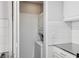 A compact laundry area with a stacked washer and dryer, conveniently tucked away at 3481 Lakeside Ne Dr # 907, Atlanta, GA 30326