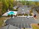 Overhead view of the community clubhouse and pool, surrounded by lush landscaping and parking at 408 Brighton Pt, Atlanta, GA 30328