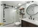 Stylish bathroom featuring a tub and shower combo, modern vanity, and decorative shelving at 408 Brighton Pt, Atlanta, GA 30328