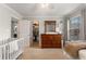 Cozy Bedroom featuring a crib, dresser, and window offering natural light at 408 Brighton Pt, Atlanta, GA 30328