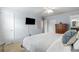 Comfortable bedroom featuring a ceiling fan, TV, and a classic wooden dresser at 408 Brighton Pt, Atlanta, GA 30328