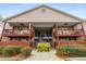 Inviting two-story condo building with a fenced ground floor and spacious balconies with fans at 408 Brighton Pt, Atlanta, GA 30328