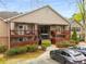 Attractive condo building featuring balconies, manicured shrubs, and convenient parking at 408 Brighton Pt, Atlanta, GA 30328