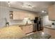 Well-lit kitchen with granite countertops, stainless steel appliances, and white subway tile backsplash at 408 Brighton Pt, Atlanta, GA 30328