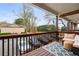 Inviting covered porch features comfortable seating, a decorative rug, and views of the neighborhood at 408 Brighton Pt, Atlanta, GA 30328