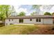 Exterior view of home with expansive backyard, patio and sliding glass door allowing for outdoor living and entertaining at 4506 Dorset Dr, Decatur, GA 30035