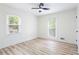 Bedroom with wood flooring, and two windows with blinds at 4506 Dorset Dr, Decatur, GA 30035