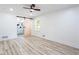 Open bedroom with hard floors and access to main bath via barn door at 4506 Dorset Dr, Decatur, GA 30035