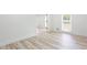 Bright bedroom with new floors, white walls, and ample natural light from the windows at 4506 Dorset Dr, Decatur, GA 30035
