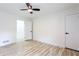 Bedroom with wood flooring and white trim, featuring a ceiling fan at 4506 Dorset Dr, Decatur, GA 30035