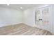 Bright bedroom featuring hardwood floors, white walls, and modern doors at 4506 Dorset Dr, Decatur, GA 30035