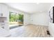 Bright dining area with sliding glass doors to the backyard and modern light fixtures at 4506 Dorset Dr, Decatur, GA 30035