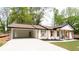 Renovated ranch home featuring an attached carport and a freshly painted brick exterior at 4506 Dorset Dr, Decatur, GA 30035