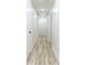 Long hallway with white walls and doors throughout the house at 4506 Dorset Dr, Decatur, GA 30035