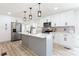 Modern kitchen with stainless steel appliances, white cabinets, and a center island at 4506 Dorset Dr, Decatur, GA 30035