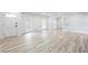 Spacious living room with new floors and a view of the yard through large windows at 4506 Dorset Dr, Decatur, GA 30035