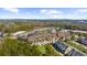 Aerial view of residences and local businesses near a street with the city skyline in the distance at 6088 Holly Park Se Ln, Mableton, GA 30126