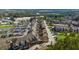 Aerial view of townhouse-style homes with parking lots, trees, and additional houses at 6088 Holly Park Se Ln, Mableton, GA 30126