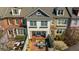 Aerial view of charming home featuring a private brick-paved patio with outdoor seating at 6088 Holly Park Se Ln, Mableton, GA 30126