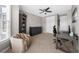 Neutral painted bedroom with carpet, a ceiling fan, and furniture; illuminated by natural light at 6088 Holly Park Se Ln, Mableton, GA 30126