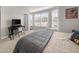 Inviting bedroom with a large window, study space, and a comfortable bed at 6088 Holly Park Se Ln, Mableton, GA 30126
