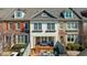 Charming townhome featuring a brick patio, two stories, and a welcoming covered porch at 6088 Holly Park Se Ln, Mableton, GA 30126