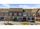Exterior of the commercial building featuring multiple storefronts with parking available in front at 6088 Holly Park Se Ln, Mableton, GA 30126