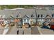 Aerial view of townhomes with brick and siding exteriors, and manicured landscaping at 6088 Holly Park Se Ln, Mableton, GA 30126