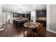 Elegant kitchen with granite countertops, dark cabinetry, and a center island with seating at 6088 Holly Park Se Ln, Mableton, GA 30126