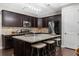 Contemporary kitchen features stainless steel appliances, granite countertops, and an island with seating at 6088 Holly Park Se Ln, Mableton, GA 30126