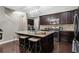 Well-appointed kitchen features a large island with seating, stainless steel appliances, and dark cabinetry at 6088 Holly Park Se Ln, Mableton, GA 30126