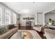 Cozy living room features neutral tones, fireplace, and ample seating with sofas and accent chairs at 6088 Holly Park Se Ln, Mableton, GA 30126