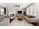 Well-lit living room with a fireplace and lots of seating perfect for gathering at 6088 Holly Park Se Ln, Mableton, GA 30126