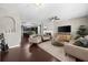 Comfortable living room with a fireplace and view into the open kitchen at 6088 Holly Park Se Ln, Mableton, GA 30126