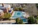 Aerial view of a large covered outdoor pool in a community with nearby buildings and landscaping at 6088 Holly Park Se Ln, Mableton, GA 30126