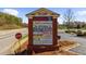 Sign for The Walk at Legacy, showcasing various businesses and shops in the area at 6088 Holly Park Se Ln, Mableton, GA 30126