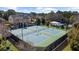 Community tennis courts surrounded by mature trees and landscaping at 6088 Holly Park Se Ln, Mableton, GA 30126