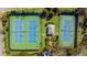Overhead view of community tennis courts and surrounding greenery in a lush neighborhood setting at 6088 Holly Park Se Ln, Mableton, GA 30126