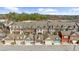 Aerial view of multi-story townhomes with attached garages and well-maintained landscaping at 6088 Holly Park Se Ln, Mableton, GA 30126