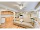 Spacious finished basement with a sofa, a wet bar, and a treadmill on wood laminate floors at 1900 Denton Walk Ct, Marietta, GA 30062