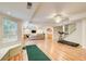 Finished basement with a treadmill, a putting green and a large sofa at 1900 Denton Walk Ct, Marietta, GA 30062