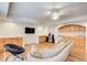 Finished basement with built in cabinets, a wet bar, a large sofa and wood laminate flooring at 1900 Denton Walk Ct, Marietta, GA 30062