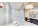 Bright bathroom featuring a glass shower, decorative lighting and cabinetry with sink at 1900 Denton Walk Ct, Marietta, GA 30062