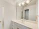 Bright bathroom featuring a vanity with a large mirror and storage cabinets at 1900 Denton Walk Ct, Marietta, GA 30062