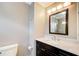 Bathroom featuring a dark wood vanity with marble countertop, and updated fixtures at 1900 Denton Walk Ct, Marietta, GA 30062