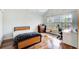 Cozy bedroom featuring hardwood floors, large window, and unique hanging chair at 1900 Denton Walk Ct, Marietta, GA 30062