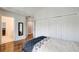 Bedroom with hardwood floors, closet with sliding doors, and neutral paint at 1900 Denton Walk Ct, Marietta, GA 30062