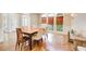 Bright dining room with wood floors, woven shades, and large windows at 1900 Denton Walk Ct, Marietta, GA 30062