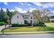 Beautiful two-story home with manicured lawn, mature landscaping, and a charming front porch at 1900 Denton Walk Ct, Marietta, GA 30062